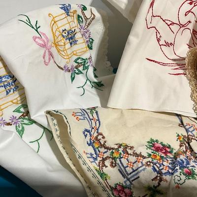 Embroidered pillow cases, dish towels, runners, bag