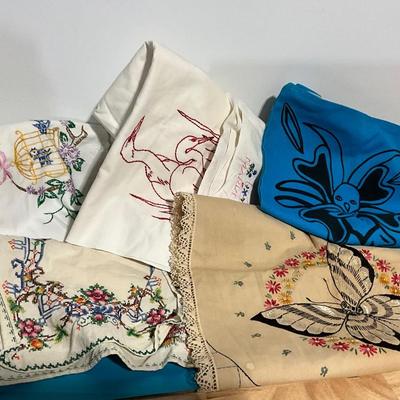 Embroidered pillow cases, dish towels, runners, bag