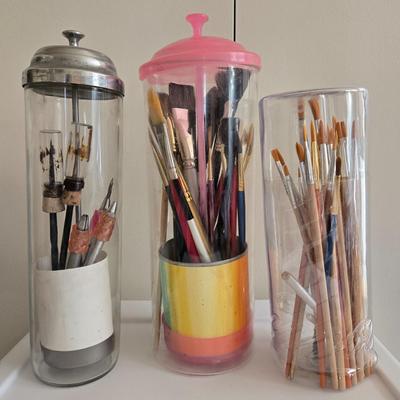 Paint Brush Caddies with Paint Brushes and a New Container of Paint Brushes