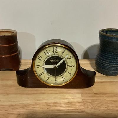 Sessions Clock and handcrafted pottery,