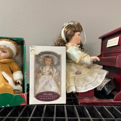 3 smaller dolls