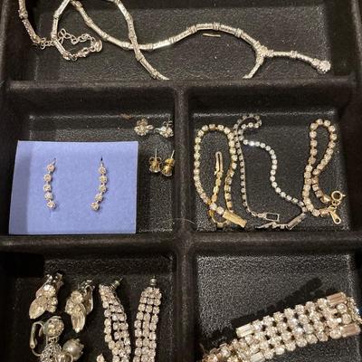 Rhinestone jewelry in a plastic storage