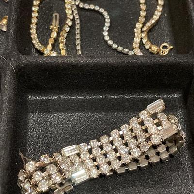 Rhinestone jewelry in a plastic storage