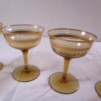 Vintage gold-rimmed champagne glasses