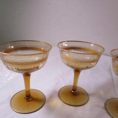 Vintage gold-rimmed champagne glasses