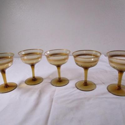 Vintage gold-rimmed champagne glasses