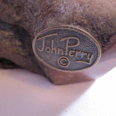 Vintage John Perry signed black otter figurine on a beryl wood stand