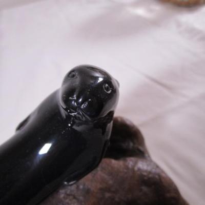 Vintage John Perry signed black otter figurine on a beryl wood stand