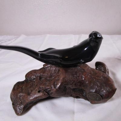 Vintage John Perry signed black otter figurine on a beryl wood stand