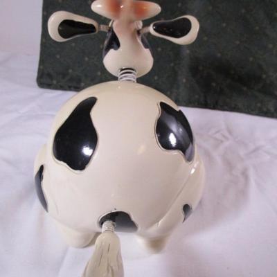 Ceramic cow figurine - head, ears, & tail are on springs