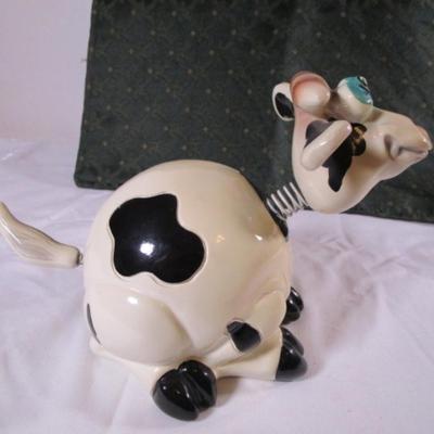 Ceramic cow figurine - head, ears, & tail are on springs