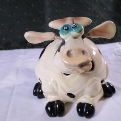 Ceramic cow figurine - head, ears, & tail are on springs
