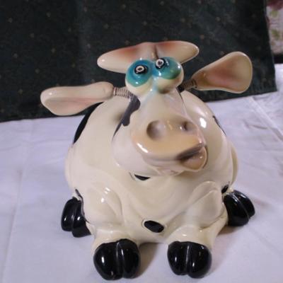 Ceramic cow figurine - head, ears, & tail are on springs