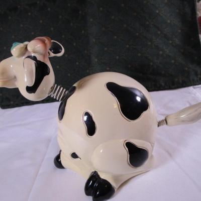 Ceramic cow figurine - head, ears, & tail are on springs