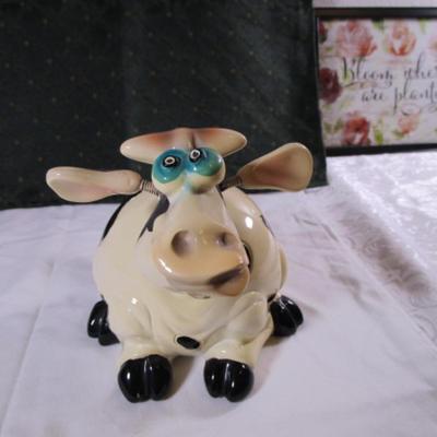Ceramic cow figurine - head, ears, & tail are on springs
