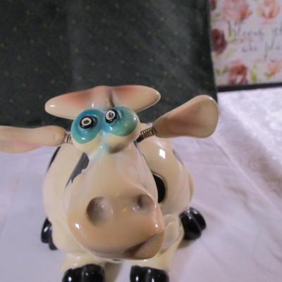 Ceramic cow figurine - head, ears, & tail are on springs