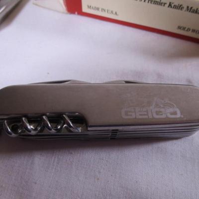 Real Leatherman with hard leather case; Geico multi-tool knife by Camillus