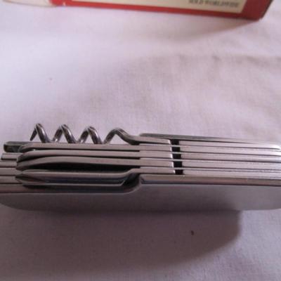 Real Leatherman with hard leather case; Geico multi-tool knife by Camillus