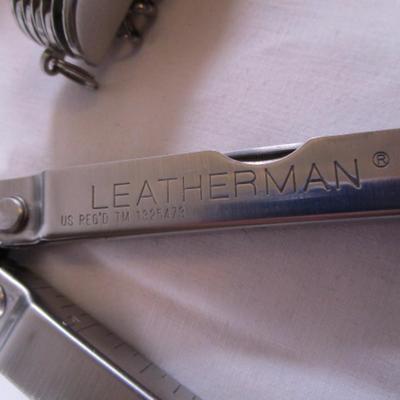 Real Leatherman with hard leather case; Geico multi-tool knife by Camillus
