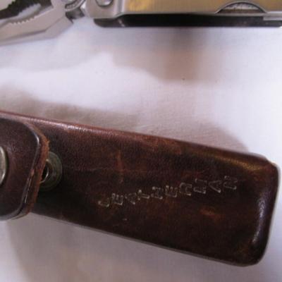 Real Leatherman with hard leather case; Geico multi-tool knife by Camillus