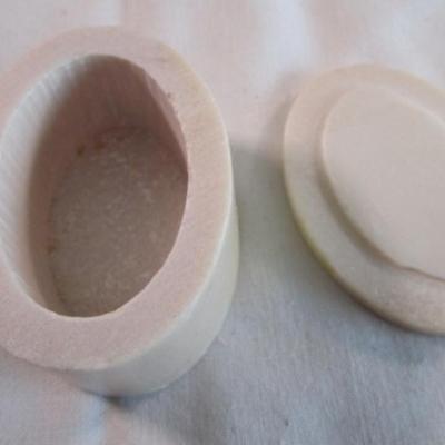 Polished stone box with inlaid flower in the lid