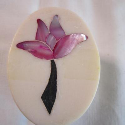 Polished stone box with inlaid flower in the lid