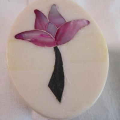 Polished stone box with inlaid flower in the lid