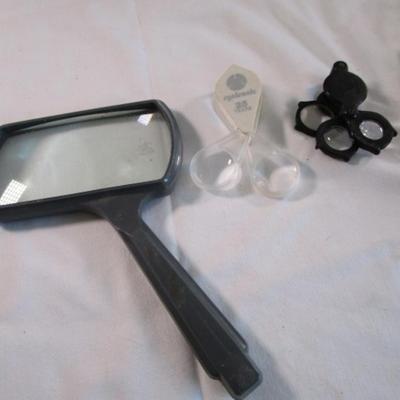 3 Magnifying glasses, 2 letter openers, 2 staple removers, 1 set earphones