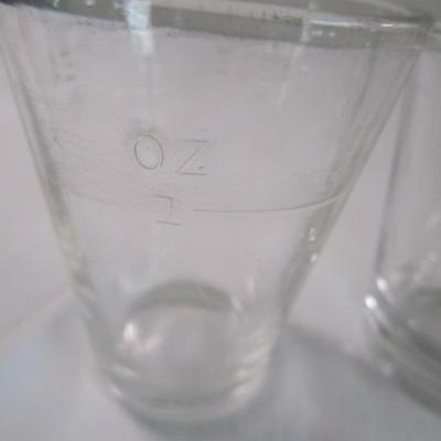 7 shot glasses, various sizes