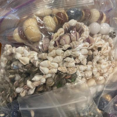 Large bag of wood bead, shell and more necklaces