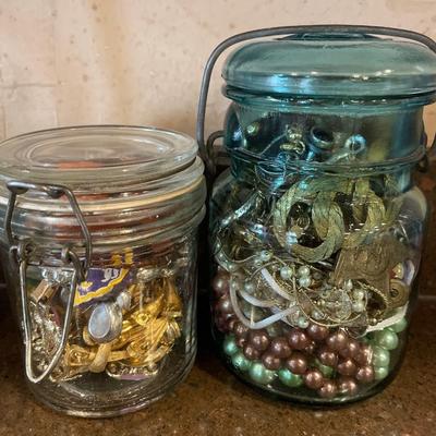 2 canisters with crafting jewelry
