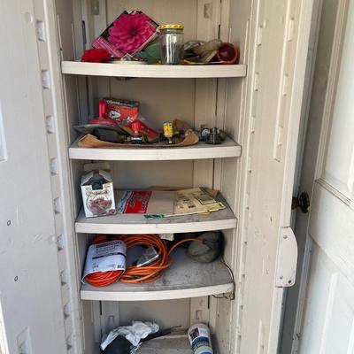 Rubbermaid cabinet with some items inside