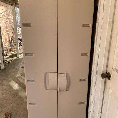 Rubbermaid cabinet with some items inside