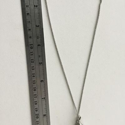 Beautiful hands in world fashion necklace