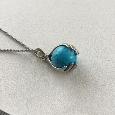 Beautiful hands in world fashion necklace