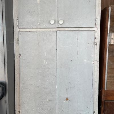 Vintage white cabinet with misc items inside