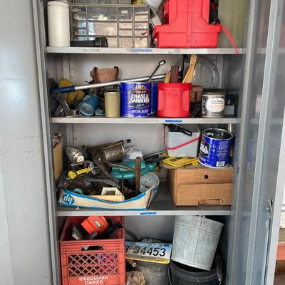 Metal cabinet full of items