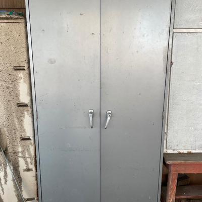 Metal cabinet full of items