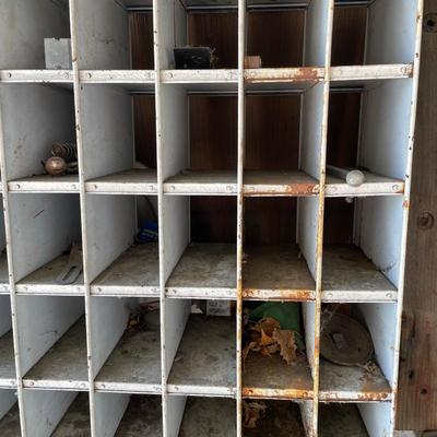 Metal slotted wall hanger