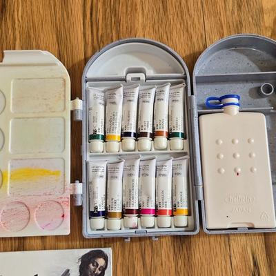Holding Travel Palette & Watercolors, Pad, and French Paint Brushes