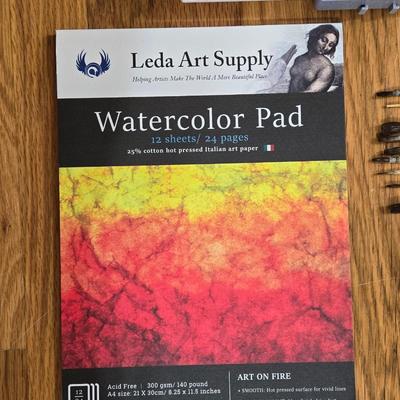 Holding Travel Palette & Watercolors, Pad, and French Paint Brushes