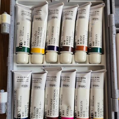 Holding Travel Palette & Watercolors, Pad, and French Paint Brushes