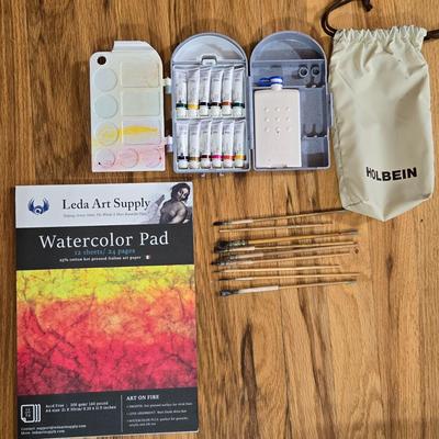 Holding Travel Palette & Watercolors, Pad, and French Paint Brushes