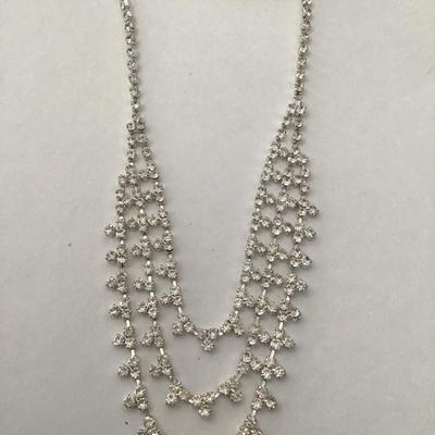 Beautiful rhinestone, silver toned statement, necklace, and earring set