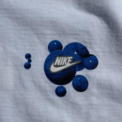 LOT 50A: Vintage 90s/Y2K Nike T Shirts & Jackets