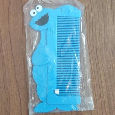 LOT 92B: Cookie Monster Comb, (4) Toys R Us Exclusive Elmo Plush Dolls and Sleepy Ernie Doll