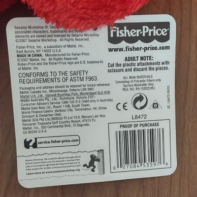 LOT 92B: Cookie Monster Comb, (4) Toys R Us Exclusive Elmo Plush Dolls and Sleepy Ernie Doll