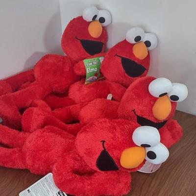 LOT 92B: Cookie Monster Comb, (4) Toys R Us Exclusive Elmo Plush Dolls and Sleepy Ernie Doll