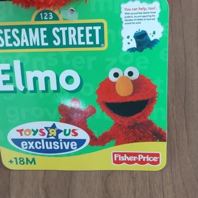 LOT 92B: Cookie Monster Comb, (4) Toys R Us Exclusive Elmo Plush Dolls and Sleepy Ernie Doll