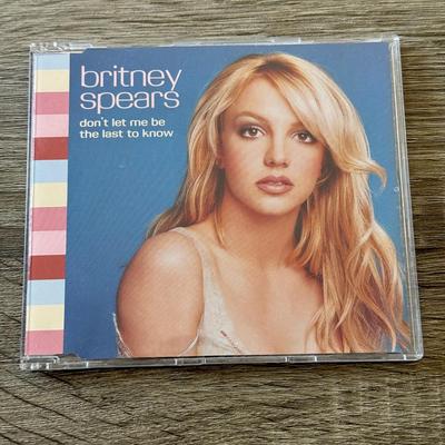 LOT 105A: Y2K Britney Spears Planet Hollywood Ladies' Shirt (Large) & Collection of CDs: Britney Spears' Boys, Don't...